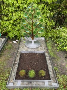 babygraf met boompje van glas